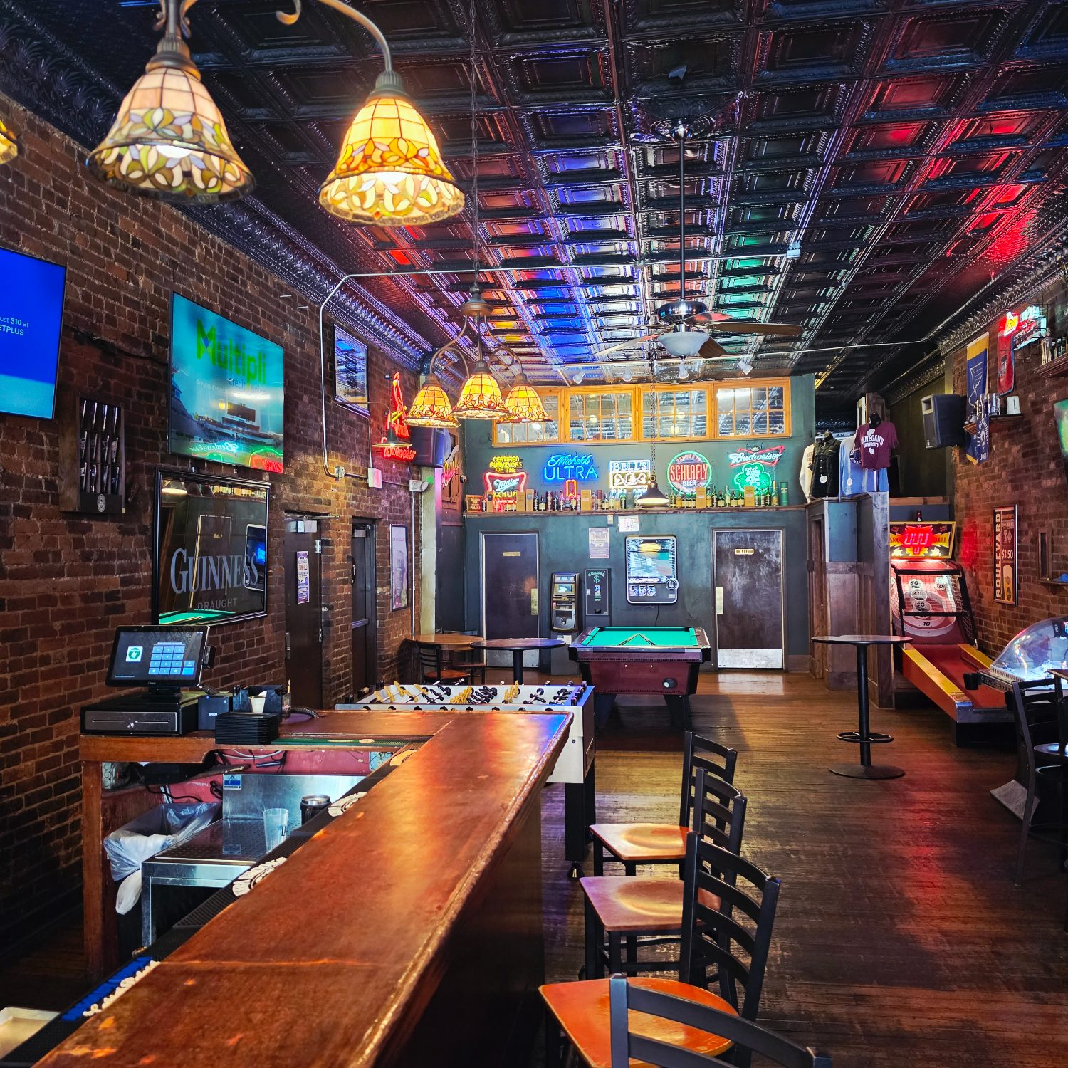 Inside Finnegan's Wake — brick walls, Tiffany lamps, the long bar