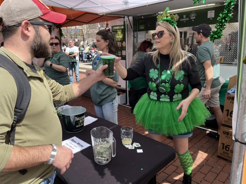 Serving drinks at a Finnegan's Wake St. Patrick's Day event