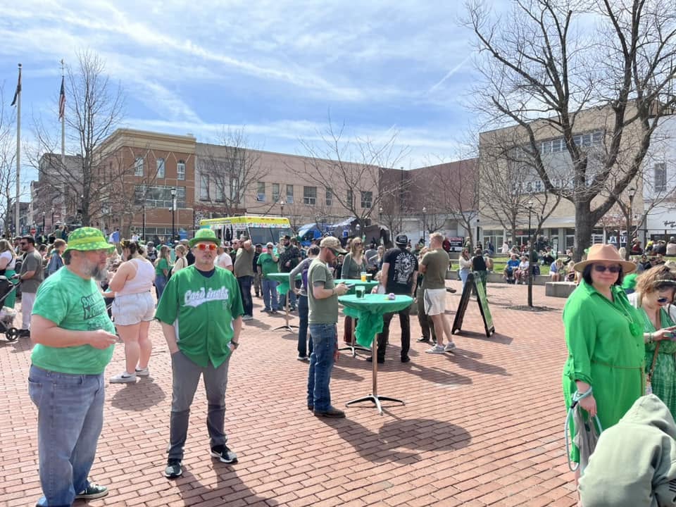 Crowd celebrating outdoors at Finnegan's Wake St. Patrick's Day
