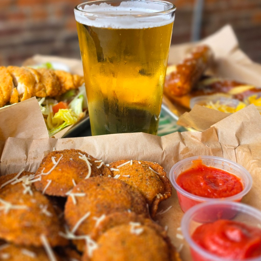 Beer with ravioli, salad, and pub favorites
