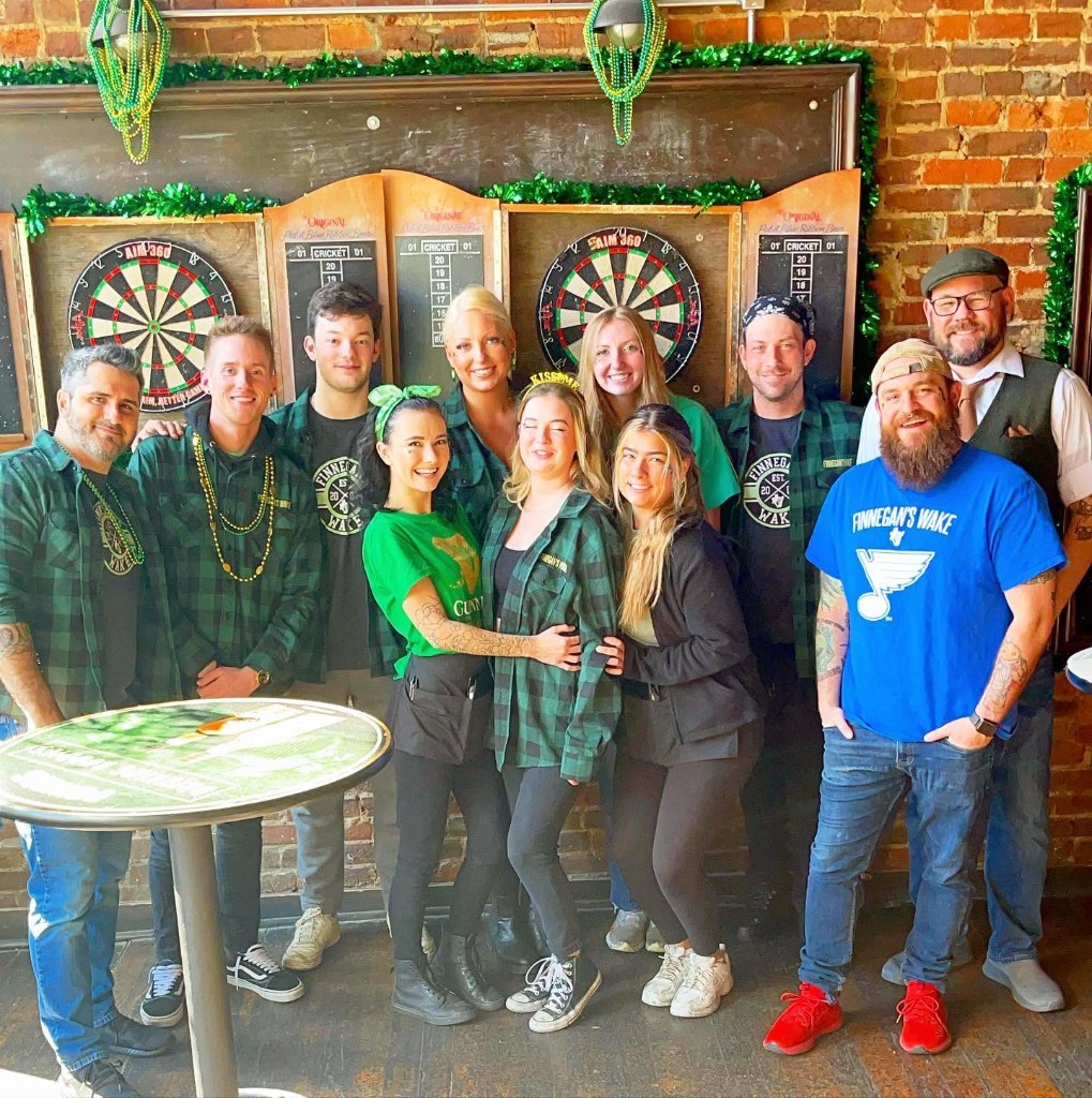 Finnegan's Wake staff celebrating St. Patrick's season