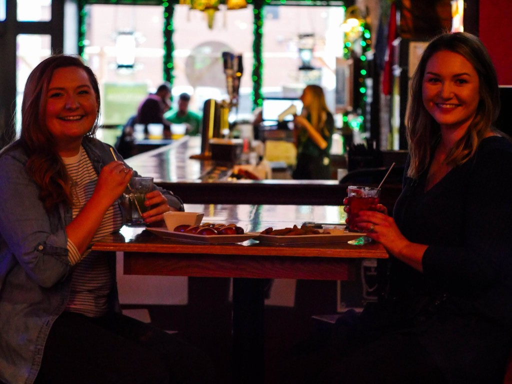 Green drinks and appetizers at the pub