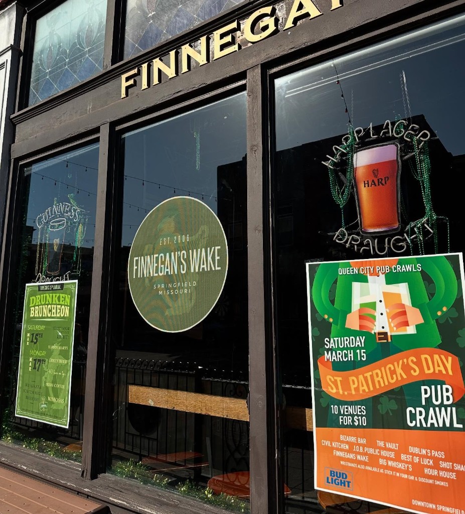 St. Patrick's Day pub crawl posters in the window